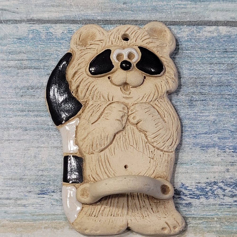 Clay Raccon wall hanging.